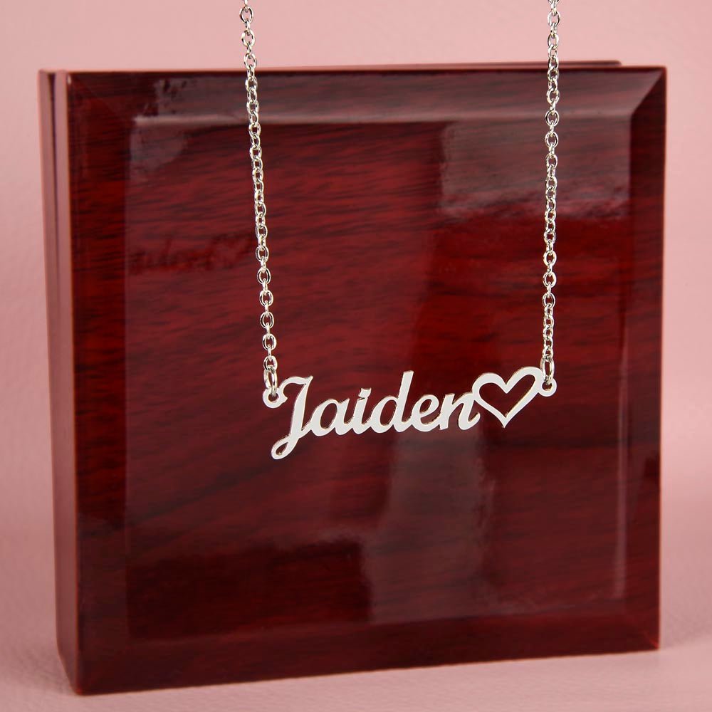 Name necklace in the color silver hanging from a luxury gift box from I Got You A Gift.