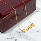 Custom name necklace for beloved pet in the color gold displayed on a luxury gift box from I Got You A Gift.