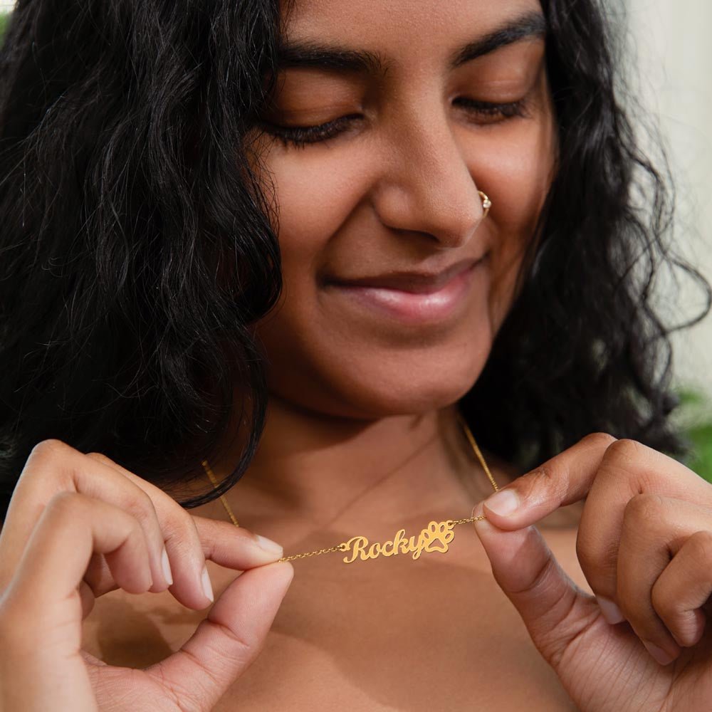 Woman wearing custom name necklace for beloved pet in the color gold from I Got You A Gift.