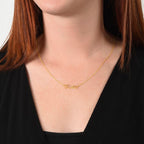 Woman wearing custom name necklace designed to celebrate meaningful connections, with any name you want.
