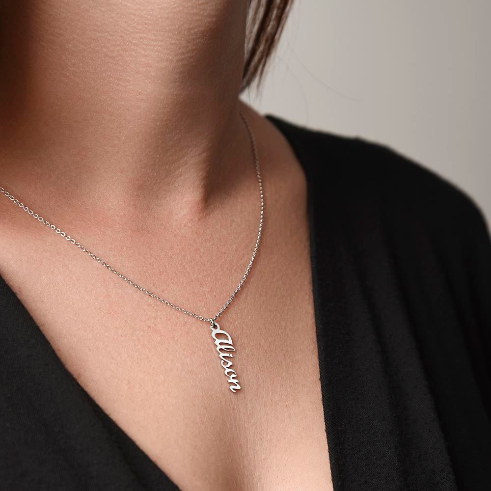 Woman wearing custom name necklace designed with her name as a personal and attentive gift.