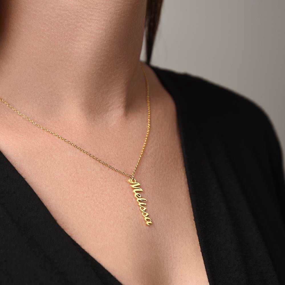 Woman wearing custom name necklace designed with her name as a personal and attentive gift in color gold.