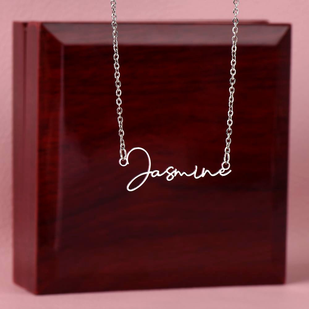 Elegant custom name necklace created with your chosen name, this one is displayed on a luxury gift box from I Got You a gift in the color silver.