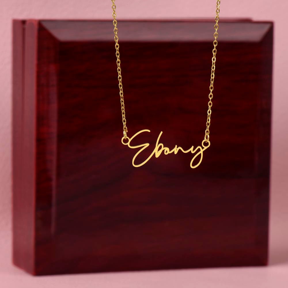 Elegant custom name necklace created with your chosen name, this one is displayed on a luxury gift box from I Got You a gift in the color gold.